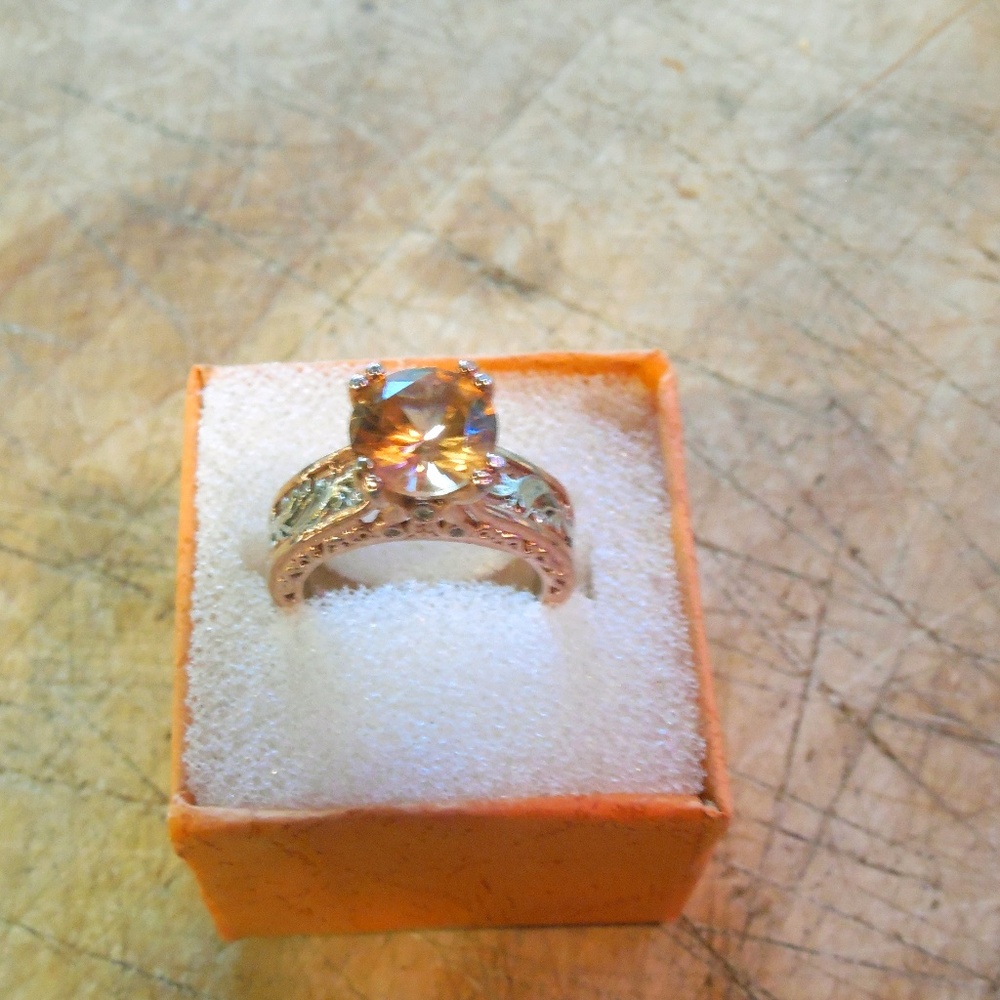 Rose gold and silver tone rin